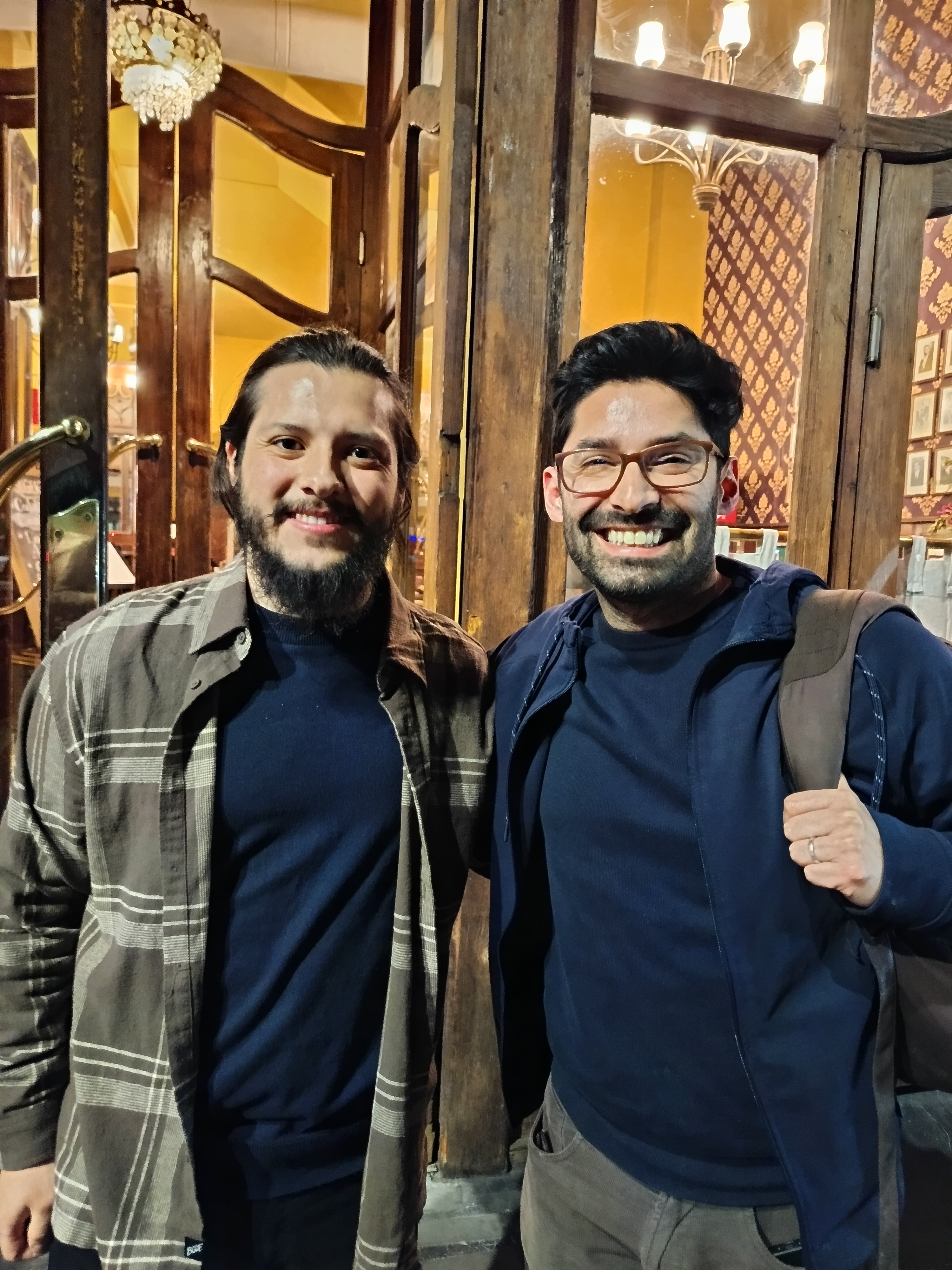 Two men smiling to the camera