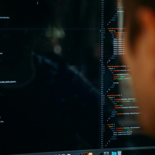 Person looking at code on a computer screen