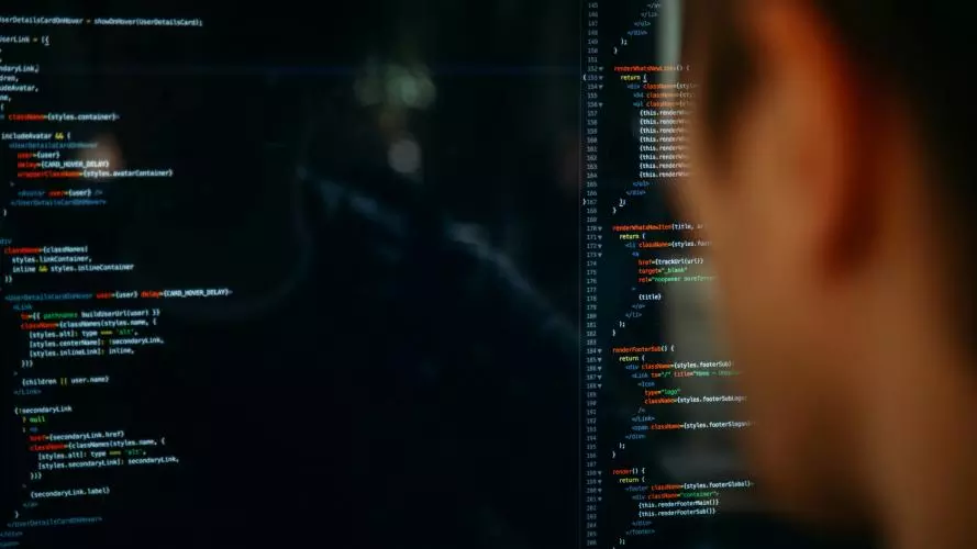 Person looking at code on a computer screen