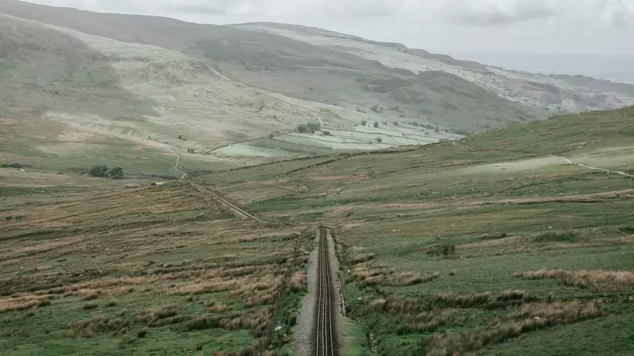 Landscape photo of a valley crossed by a railway line
