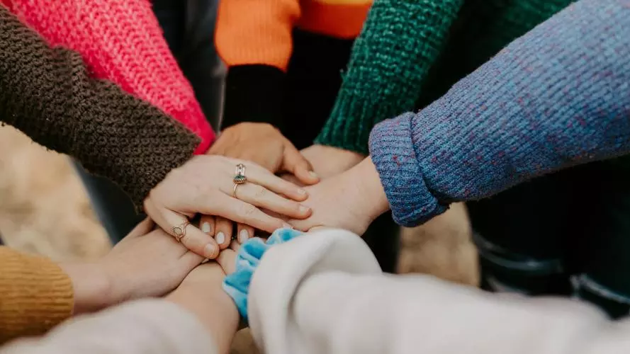 seven hands together