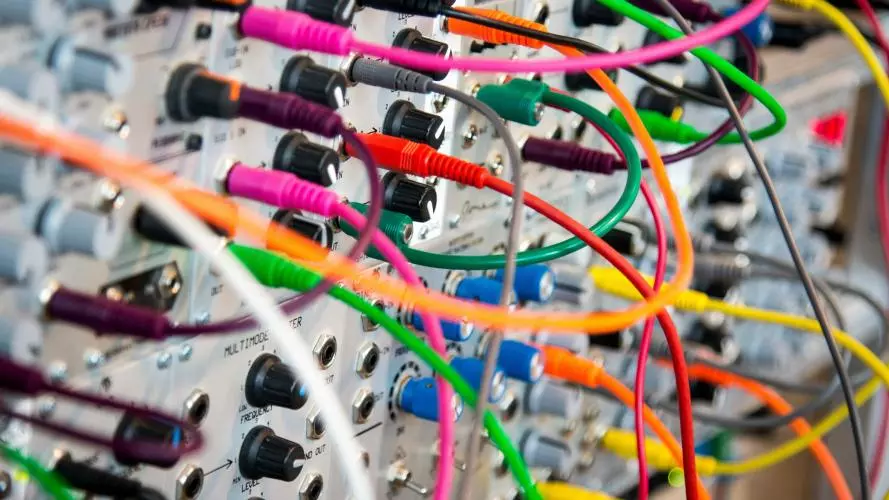 An electric board with connected cables of different colours