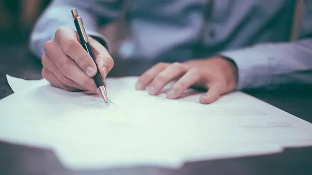 Businessperson writing
