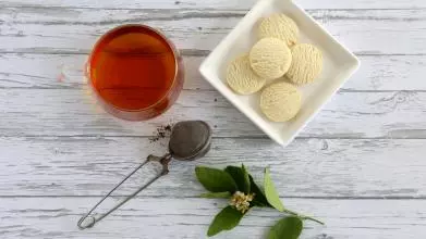 Photo of a cup of tea and biscuits