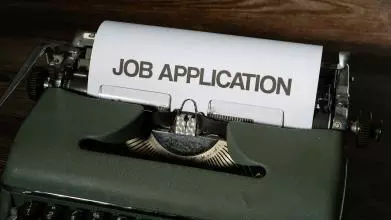 A typewriter with a Job application within
