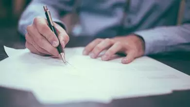 Businessperson writing
