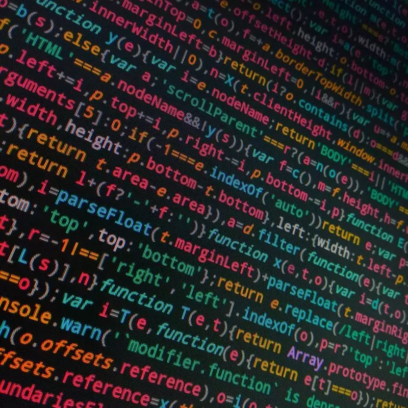 Tilted photo of coding text on a black screen