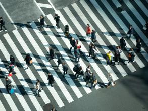 Different people crossing a road