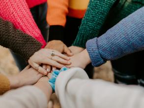 seven hands together