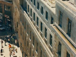 Photo of one of the terrace of one of LSE buildings, where a lot of people are njoying the sunny weather. 