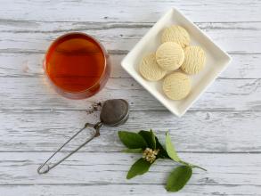 Photo of a cup of tea and biscuits