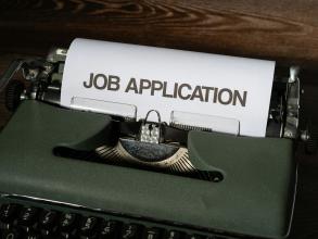 A typewriter with a Job application within