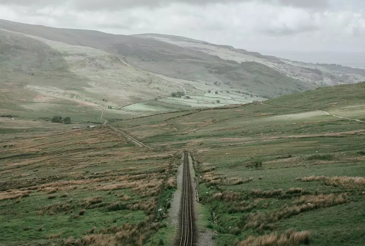 Landscape photo of a valley crossed by a railway line